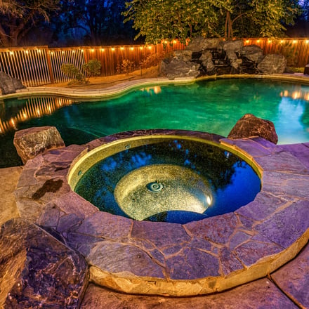 Yosemite Log Retreat pool and spa lit at night