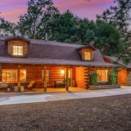 Yosemite Log Retreat log cabin exterior at dusk