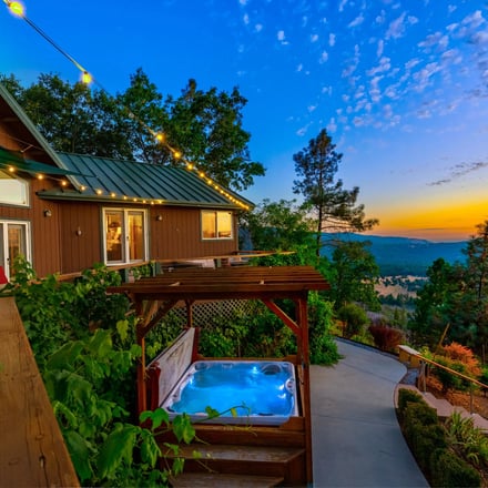 Skyline Lodge hot tub with mountain view at sunset