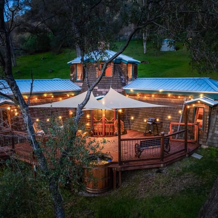 Halfling House aerial exterior at dusk